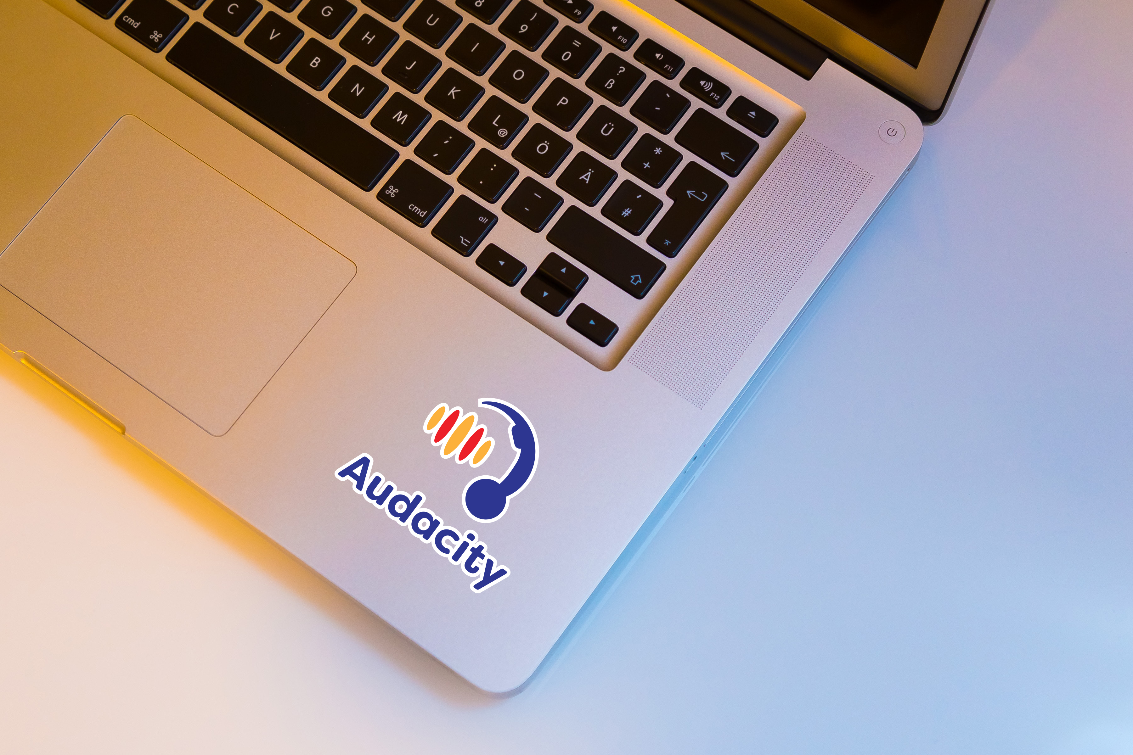 Shiny pieces of aluminum wrapping next to various plastic trash.